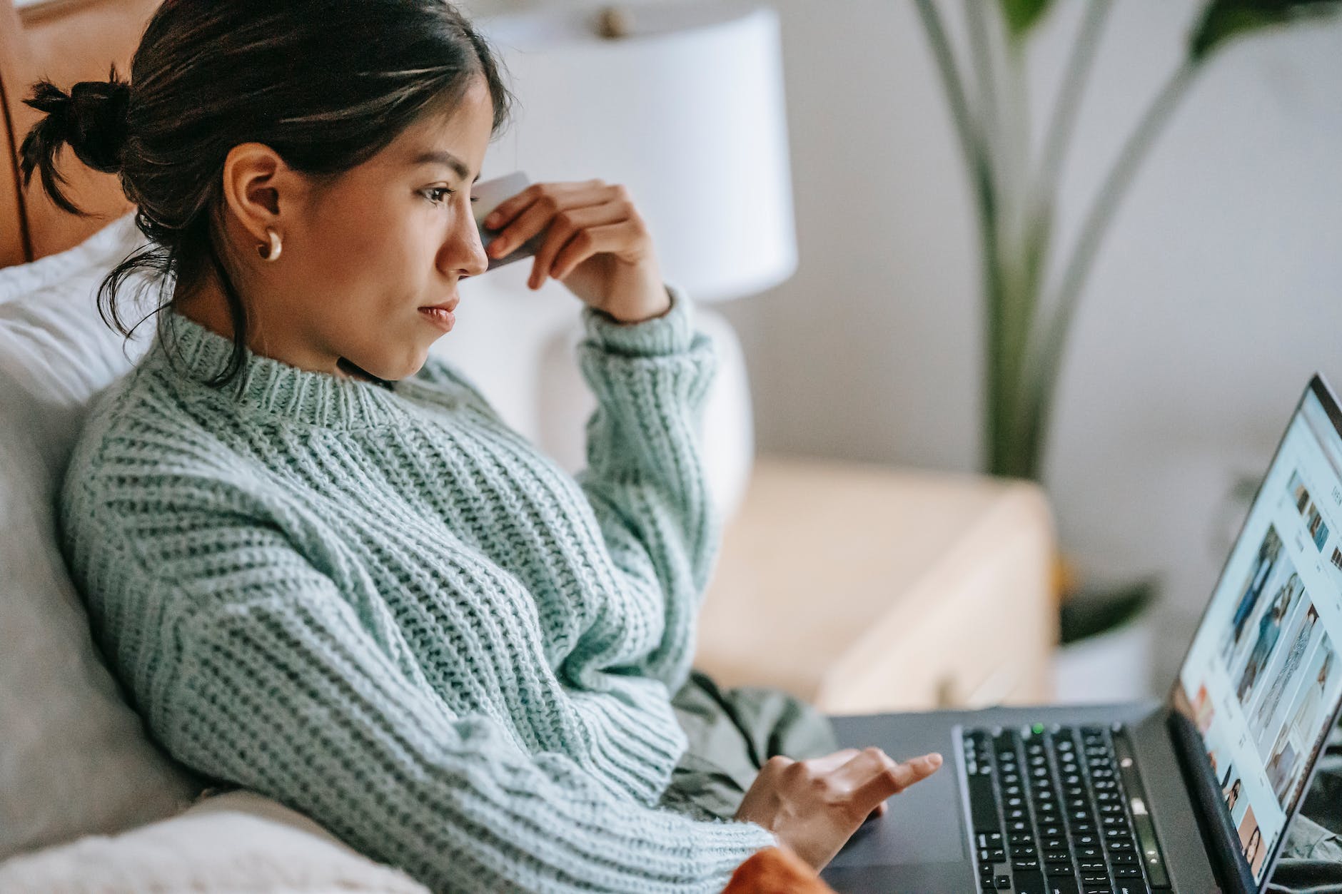 focused young ethnic woman with credit card and laptop - E-commerce Shopping - Digital Marketing